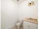 Powder room with a marble sink at 9071 Selborne Ln, Chattahoochee Hills, GA 30268