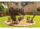 Spacious backyard featuring a fire pit area and a raised deck, ideal for relaxation at 1542 Idlewood Rd, Tucker, GA 30084
