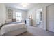 Bright bedroom with a bed, neutral carpet, and an ensuite bathroom at 1542 Idlewood Rd, Tucker, GA 30084