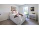 Airy bedroom featuring a comfortable bed, desk, chair, and natural light at 1542 Idlewood Rd, Tucker, GA 30084