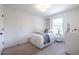 Cozy bedroom featuring a bed, dresser, and window with natural light at 1542 Idlewood Rd, Tucker, GA 30084
