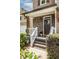 Charming front porch with stone accents, a covered entryway, and manicured landscaping at 1542 Idlewood Rd, Tucker, GA 30084