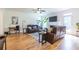 Bright living room featuring hardwood floors, comfortable seating, fireplace, and ample natural light at 1542 Idlewood Rd, Tucker, GA 30084