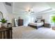 Spacious main bedroom with trey ceiling, ceiling fan, neutral carpet, large windows and walk-in closet at 1542 Idlewood Rd, Tucker, GA 30084