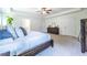 Main bedroom with tray ceiling, ceiling fan, neutral carpet, and ensuite bathroom at 1542 Idlewood Rd, Tucker, GA 30084