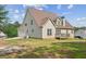 Back exterior with deck, backyard and three-car garage at 167 Gothards Creek Dr, Powder Springs, GA 30127