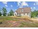 Backyard with a raised deck and spacious lawn, ideal for outdoor activities at 167 Gothards Creek Dr, Powder Springs, GA 30127