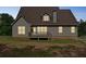 The backyard features a wooden deck and a view of the home's exterior at 167 Gothards Creek Dr, Powder Springs, GA 30127