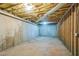 Unfinished basement with exposed ceiling, concrete walls and floor offering potential for customization at 167 Gothards Creek Dr, Powder Springs, GA 30127
