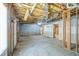 Unfinished basement with concrete flooring, exposed ceiling and framing, offering expansion potential at 167 Gothards Creek Dr, Powder Springs, GA 30127