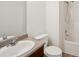 This bathroom includes a white toilet, shower, and vanity at 167 Gothards Creek Dr, Powder Springs, GA 30127