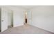 Bedroom featuring neutral carpet, white walls, open closet and views to another room at 167 Gothards Creek Dr, Powder Springs, GA 30127