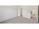 Bedroom with neutral carpet, white walls, open door and closet for ample storage at 167 Gothards Creek Dr, Powder Springs, GA 30127