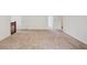 Bedroom featuring neutral carpet, white walls, staircase with rail and access to another room at 167 Gothards Creek Dr, Powder Springs, GA 30127
