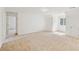 Spacious bonus room featuring carpeted floors and natural light from a window at 167 Gothards Creek Dr, Powder Springs, GA 30127