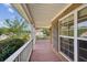 Long, covered porch with pink floors and brick exterior at 167 Gothards Creek Dr, Powder Springs, GA 30127
