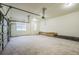Spacious garage with concrete floors, windows for natural light, and an overhead door at 167 Gothards Creek Dr, Powder Springs, GA 30127