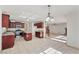 Spacious eat-in kitchen with tiled floors and adjacent living area with fireplace at 167 Gothards Creek Dr, Powder Springs, GA 30127