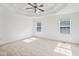 Spacious main bedroom features a ceiling fan, neutral carpet and natural light at 167 Gothards Creek Dr, Powder Springs, GA 30127