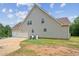 View of the side of the house showing the three-car garage at 167 Gothards Creek Dr, Powder Springs, GA 30127