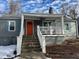 Charming single-story home with a welcoming front porch, bright door, and lovely blue shutters at 3006 Dogwood Dr, Hapeville, GA 30354