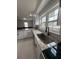 Bright kitchen with granite counters, stainless steel sink, and ample natural light from a large window at 3006 Dogwood Dr, Hapeville, GA 30354