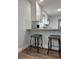 Stylish kitchen with granite countertops, white cabinetry, stainless steel appliances, and breakfast bar at 3006 Dogwood Dr, Hapeville, GA 30354