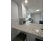 Stylish kitchen with granite countertops, white cabinetry, stainless steel appliances, and breakfast bar at 3006 Dogwood Dr, Hapeville, GA 30354
