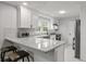 Stylish kitchen with granite countertops, white cabinetry, stainless steel appliances, and breakfast bar at 3006 Dogwood Dr, Hapeville, GA 30354