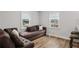 Cozy living room with hardwood floors, comfortable seating, and lots of natural light at 3006 Dogwood Dr, Hapeville, GA 30354