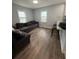 Cozy living room with hardwood floors, comfortable seating, and lots of natural light at 3006 Dogwood Dr, Hapeville, GA 30354