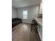 Cozy living room with hardwood floors, comfortable seating, and lots of natural light at 3006 Dogwood Dr, Hapeville, GA 30354