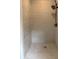 Tiled shower with a rainfall shower head and light grout at 3006 Dogwood Dr, Hapeville, GA 30354