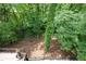 A wooded backyard with a view from a wooden patio at 306 Pinecrest Ne Rd, Atlanta, GA 30342