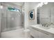 A full bathroom with bright tile, a glass shower, and modern finishes at 306 Pinecrest Ne Rd, Atlanta, GA 30342