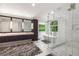 Bright bathroom with a double vanity, luxurious tub and spacious glass shower at 306 Pinecrest Ne Rd, Atlanta, GA 30342