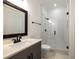 Beautiful bathroom featuring a glass shower with stylish tile, a modern vanity, and sleek fixtures at 306 Pinecrest Ne Rd, Atlanta, GA 30342
