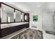 Bathroom featuring a double vanity, freestanding tub and glass enclosed shower at 306 Pinecrest Ne Rd, Atlanta, GA 30342