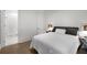 Contemporary bedroom featuring neutral tones, hardwood floors, and ensuite bathroom with a glass shower at 306 Pinecrest Ne Rd, Atlanta, GA 30342