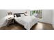Modern bedroom with large window letting in natural light, complemented by stylish bedside lamps at 306 Pinecrest Ne Rd, Atlanta, GA 30342