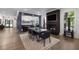 Elegant dining room featuring a wet bar and a black marble fireplace with television above at 306 Pinecrest Ne Rd, Atlanta, GA 30342