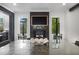 Contemporary dining room area highlighting the fireplace and television set between the windows at 306 Pinecrest Ne Rd, Atlanta, GA 30342