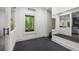 Bright exercise room with mirrored wall, durable flooring, and natural light at 306 Pinecrest Ne Rd, Atlanta, GA 30342