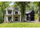 Beautiful two-story home featuring stone accents, covered porch, and well-manicured lawn at 306 Pinecrest Ne Rd, Atlanta, GA 30342