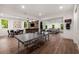 Open-concept game room with ping pong table, bar, and large sectional sofa at 306 Pinecrest Ne Rd, Atlanta, GA 30342