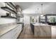 Bright kitchen featuring sleek cabinets, marble counters, stainless steel appliances, and open layout at 306 Pinecrest Ne Rd, Atlanta, GA 30342