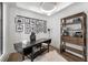 Bright home office with stylish desk, shelving unit, and curated photo display at 306 Pinecrest Ne Rd, Atlanta, GA 30342