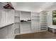 Spacious walk-in closet with custom shelving and ample storage at 306 Pinecrest Ne Rd, Atlanta, GA 30342