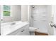 Bathroom featuring a white vanity, toilet, and a shower with a white shower stall at 3990 N Quail Dr, Douglasville, GA 30135