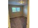 Cozy bedroom with neutral carpet, neutral paint, and a window offering plenty of natural light at 3990 N Quail Dr, Douglasville, GA 30135